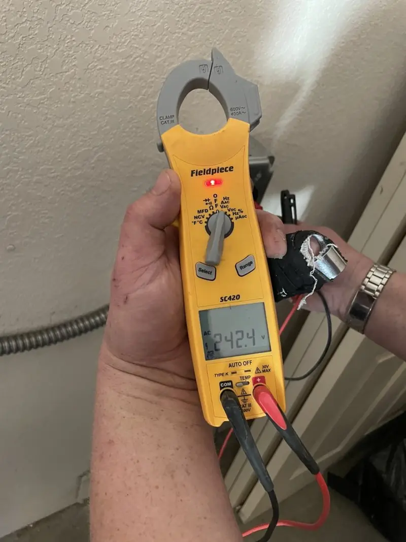 Voltage testing with clamp meter during Aluminum Wiring Replacement in Corcoran